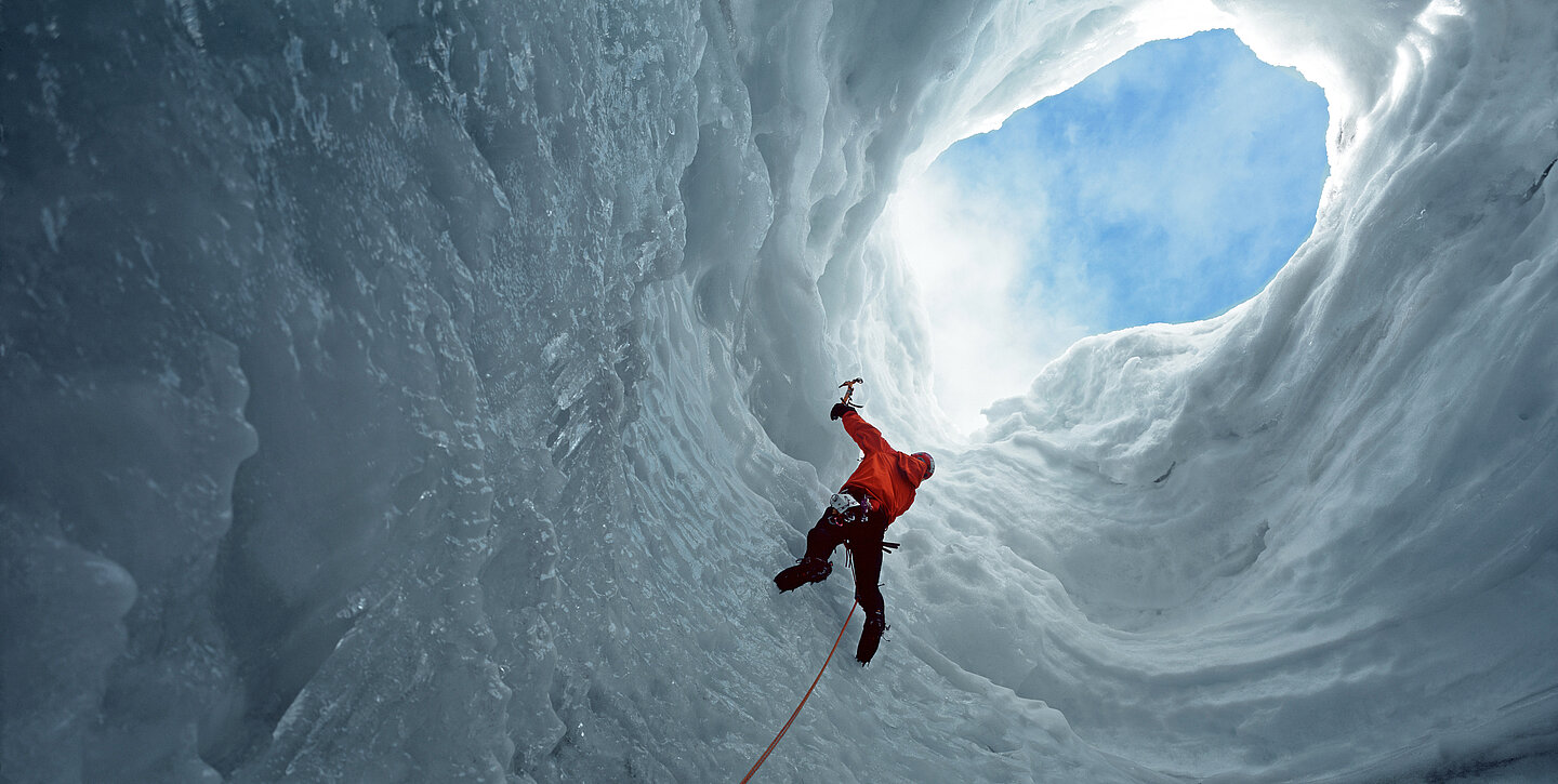 A climber in an ice cave