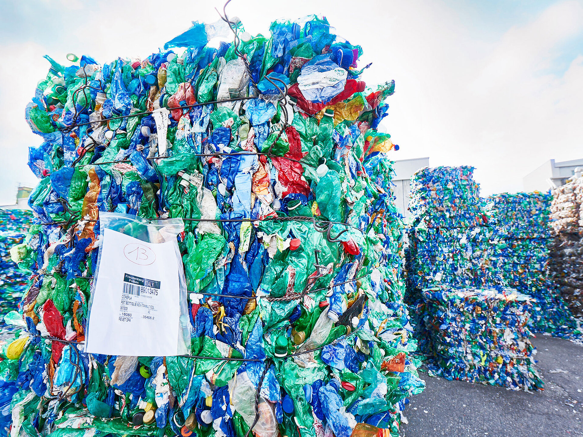 A bundled load of plastic bottles arrives in Novedrate